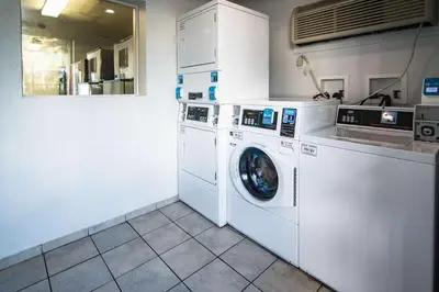 a laundry room with a washer and dryer at Motel 6-Kissimmee, FL - Orlando in Orlando