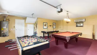 a room with a pool table and a piano at Closest to Disney in Orlando