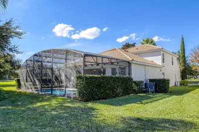 a greenhouse in front of a house at Disney Daze Villa - 5 bed Windsor Hills pool home in Orlando