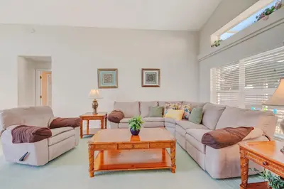 a living room with two couches and a coffee table at Quiet Home With Private Pool- Near Disney in Kissimmee
