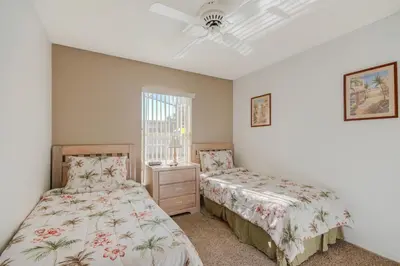 a bedroom with two beds and a window at Quiet Home With Private Pool- Near Disney in Kissimmee