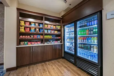 a refrigerator filled with lots of food and drinks at Best Western Plus Orlando East - UCF Area in Orlando
