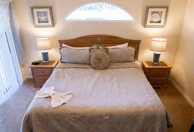 a bedroom with a large bed with two night stands at Private Pool House With Private Pool, Near All Famous Attractions!!! in Kissimmee