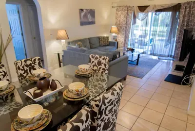 a living room with a couch and a table at Private Pool House With Private Pool, Near All Famous Attractions!!! in Kissimmee