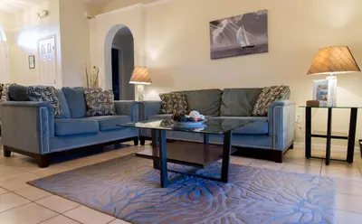 a living room with two couches and a coffee table at Private Pool House With Private Pool, Near All Famous Attractions!!! in Kissimmee