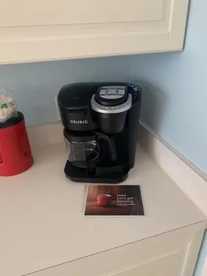 a coffee maker sitting on top of a counter at Mickey Holiday Home a Windsor Palms Villa in Kissimmee