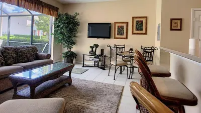 a living room with a couch and a table at Silver Palms in Kissimmee