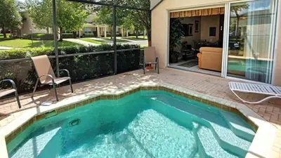 a swimming pool in the middle of a house at Silver Palms in Kissimmee