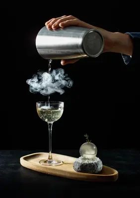 a person is pouring wine into a glass at ette luxury hotel & spa - Near Disney Theme Parks in Orlando