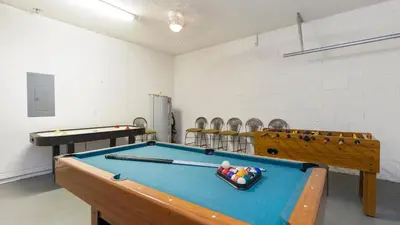 a room with a pool table in it at Palm Key Villa 7 bed on Emerald Island Resort in Kissimmee