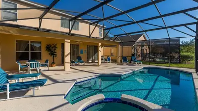 a swimming pool with a glass roof over it at Palm Key Villa 7 bed on Emerald Island Resort in Kissimmee