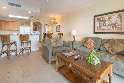 a living room with a couch and a table at Beautiful Apartment close to Disney, fully equipped Amazing lake views in Orlando