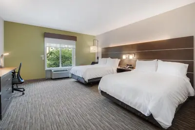a hotel room with two beds and a window at Holiday Inn Express Hotel & Suites Orlando - Apopka by IHG in Orlando