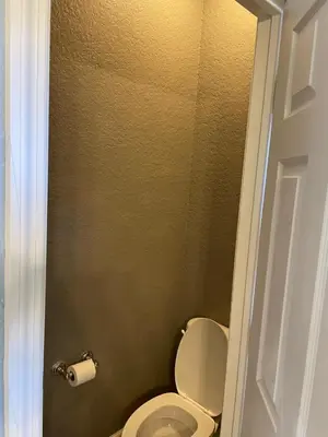 a bathroom with a toilet and a roll of toilet paper at Windsor Hills Resort 5BR Villa, Amenities, Private Pool & Water Park, Near Disney, Sea World, Universal in Orlando