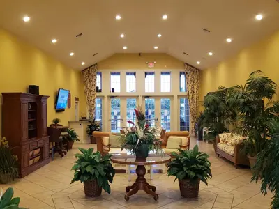 a lobby with potted plants and a table at Kissimmee 3bed Villa Near Disney in Kissimmee