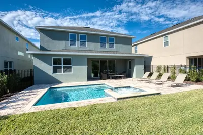 a house with a swimming pool in the yard at Lovely Home With Private Pool And Air Hockey Table Near Disney With Waterpark & Resort Access At Encore Resort - 7467Mr in Kissimmee