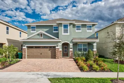 a house with a driveway in front of it at Lovely Home With Private Pool And Air Hockey Table Near Disney With Waterpark & Resort Access At Encore Resort - 7467Mr in Kissimmee