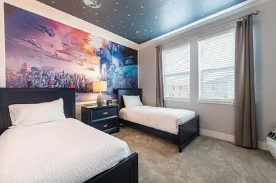 two beds in a room with a painting on the wall at Remarkable Home Near Disney With Theater & Themed Rooms With Waterpark & Resort Access At Encore Resort - 7660Ff in Kissimmee