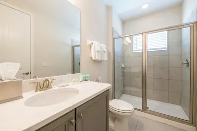 a bathroom with a sink and a toilet and a shower at Cozy Home With Private Pool, Air Hockey Table Near Disney With Waterpark & Resort Access At Encore Resort - 7702Gr in Kissimmee