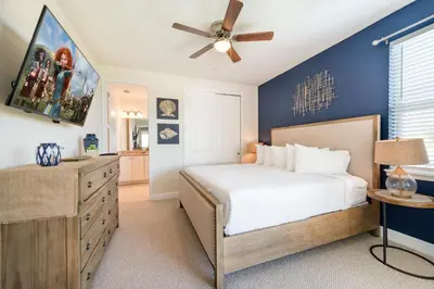 a bedroom with a bed and a ceiling fan at Spectacular Home With Theater, Theme Rooms Near Disney With Waterpark & Resort Access At Encore Resort - 7734Gr in Kissimmee