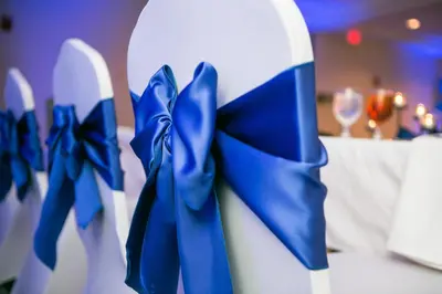 a blue bow on the side of a cake at Holiday Inn Orlando East-UCF Area by IHG in Orlando