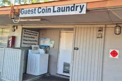 a front entrance to a guest corn laundry building at Arrow Motel by OYO Near Downtown in Orlando