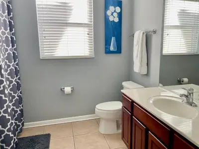 a bathroom with a toilet and a sink at My Disney Castle in Orlando
