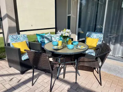 a table and chairs on a patio at My Disney Castle in Orlando
