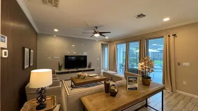 a living room with a couch and a table at 3830 Premier Villa 6Bd Private Pool and Game Room in Kissimmee