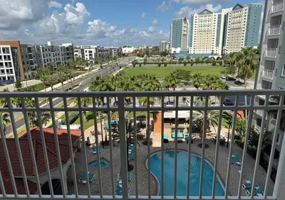 a view of the city from the balcony of a resort at The Point Hotel & Suites - 503 Luxury - Pool view - Close to Universal in Orlando