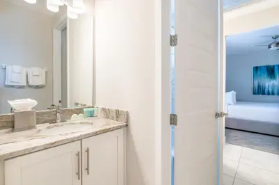 a bathroom with a sink and a mirror at Magnificent Home Near Disney With Theater Room, Pool Table, Waterpark & Resort Access At Encore Resort Reunion - 7448Mr in Kissimmee