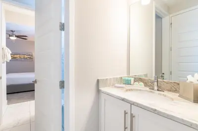 a bathroom with a sink and a mirror at Magnificent Home Near Disney With Theater Room, Pool Table, Waterpark & Resort Access At Encore Resort Reunion - 7448Mr in Kissimmee