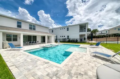 a pool in the backyard of a house at Magnificent Home Near Disney With Theater Room, Pool Table, Waterpark & Resort Access At Encore Resort Reunion - 7448Mr in Kissimmee