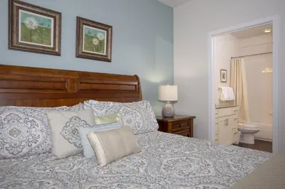 a bedroom with a bed with pillows on it at 2956 Lucaya Village - Gorgeous Four Bed Condo Close to Disney Area in Kissimmee