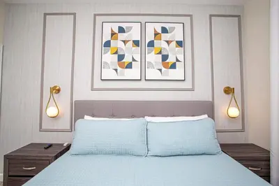 a bedroom with a bed with two lights above it at Gorgeous 4 Bedroom w/ Pool Close to Disney 4836 in Kissimmee