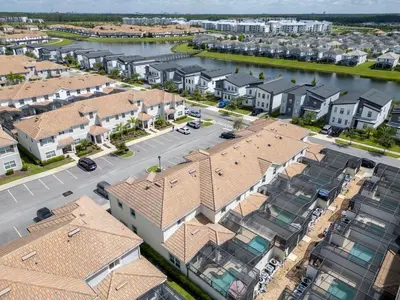 an aerial view of a city with houses and a river at Renewed Luxury Townhouse with private pool in Kissimmee