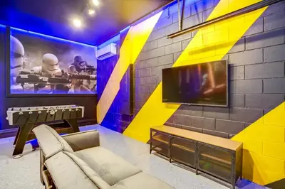 a room with a couch and a wall with a tv at Jedi Temple! Take A Virtual Tour Private Pool! Villa in Orlando