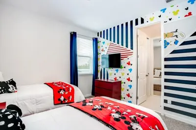 a bedroom with two beds and a striped wall at Jedi Temple! Take A Virtual Tour Private Pool! Villa in Orlando