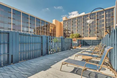 a row of benches in front of a building at Best Western Orlando Gateway Hotel in Orlando