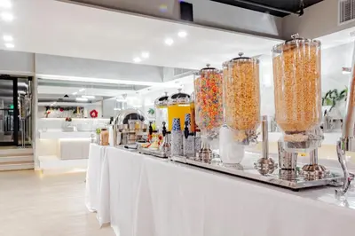 a store with a white counter with jars of food at Palazzo Lakeside Hotel in Kissimmee
