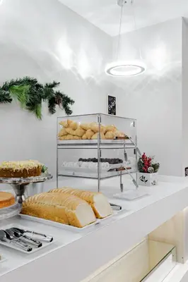 a bakery counter with bread and other baked goods at Palazzo Lakeside Hotel in Kissimmee