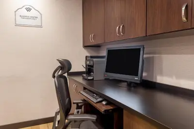 a computer sitting on a desk in a room at Wingate by Wyndham, Universal Studios - Free Theme Park Shuttle in Orlando