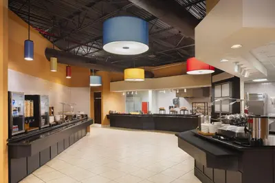 a fast food restaurant with aasteryasteryasteryasteryasteryasteryasteryasteryasteryastery at Holiday Inn & Suites Orlando SW - Celebration Area by IHG in Orlando
