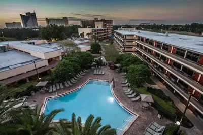 an aerial view of a hotel with a pool and buildings at Rosen Inn at Pointe Orlando in Orlando