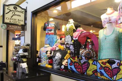 a store window with a bunch of clothes in it at Rosen Inn at Pointe Orlando in Orlando