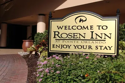 a sign that says welcome to ryan inn at portland airportavoid your stay at Rosen Inn at Pointe Orlando in Orlando