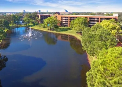 an aerial view of a lake in front of a building at Rosen Inn Lake Buena Vista in Orlando