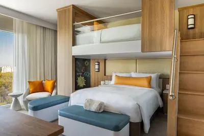 a hotel room with a bed and a desk at JW Marriott Orlando Bonnet Creek Resort & Spa in Orlando
