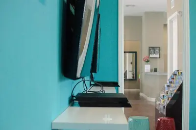 a computer monitor sitting on top of a desk at Fantastic Townhouse in Lux community sleeps 8, 10' to Disney!! in Kissimmee