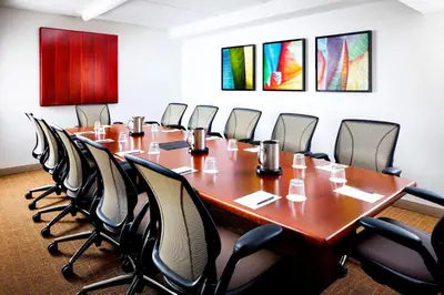 a conference room with a long table and chairs at Sheraton Suites Orlando Airport Hotel in Orlando